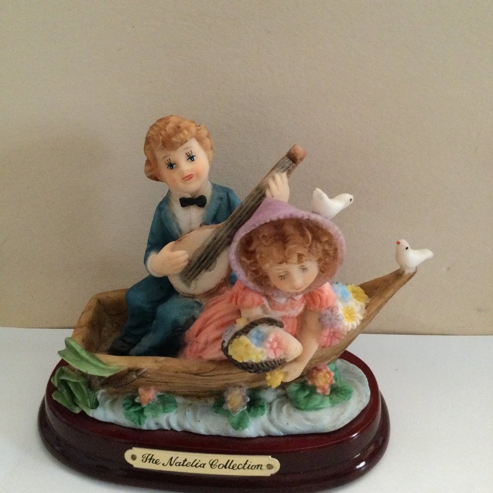 The Natelia Collection figurine table top decor boy and girl on boat like new